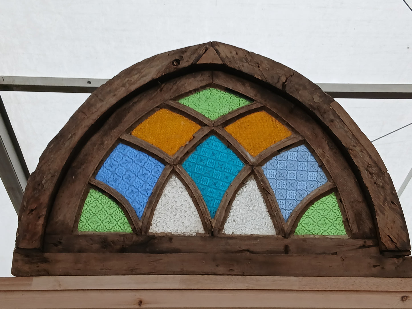 Arched stained glass fanlight window