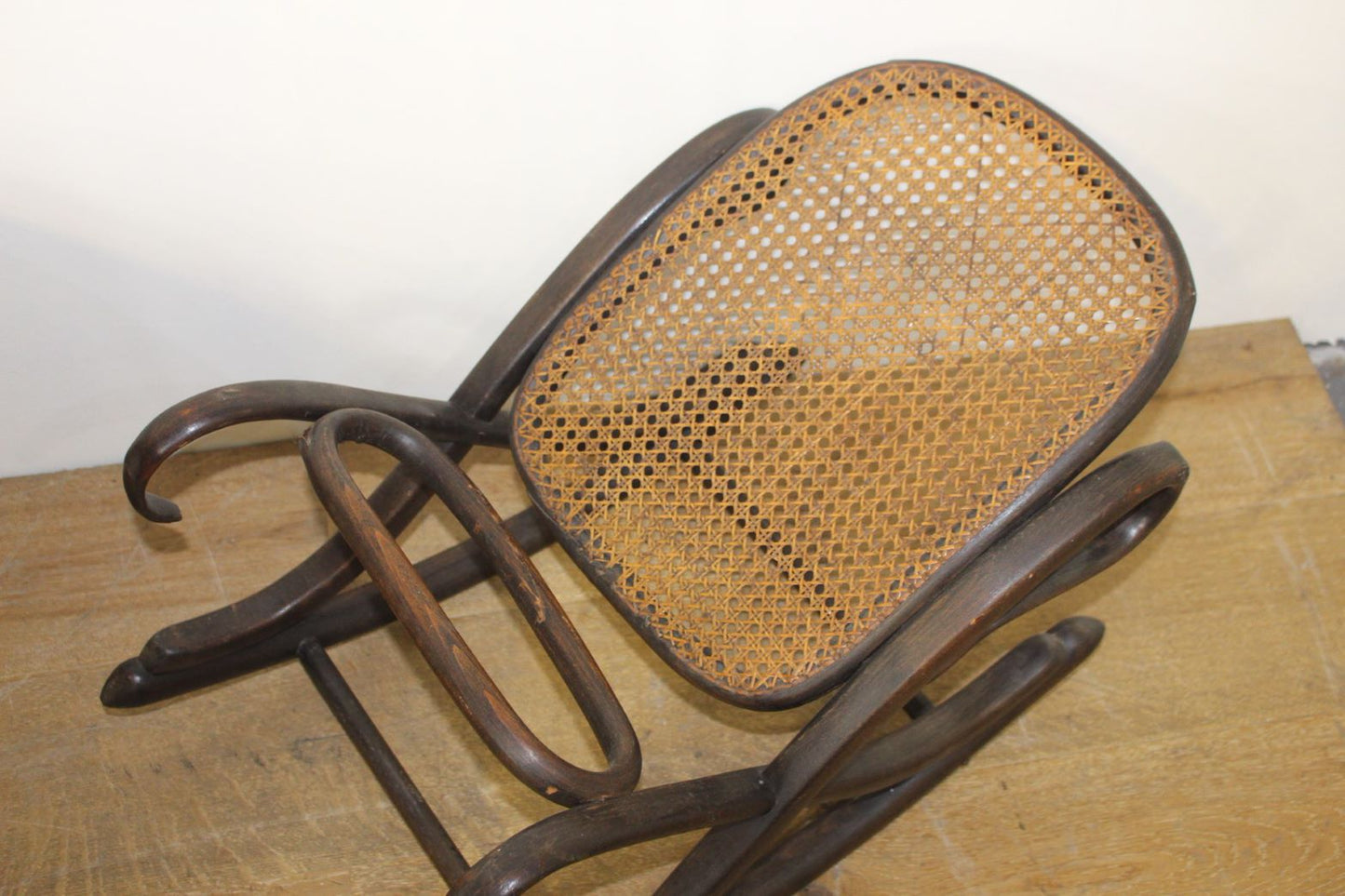 Bentwood rocking rattan footrest