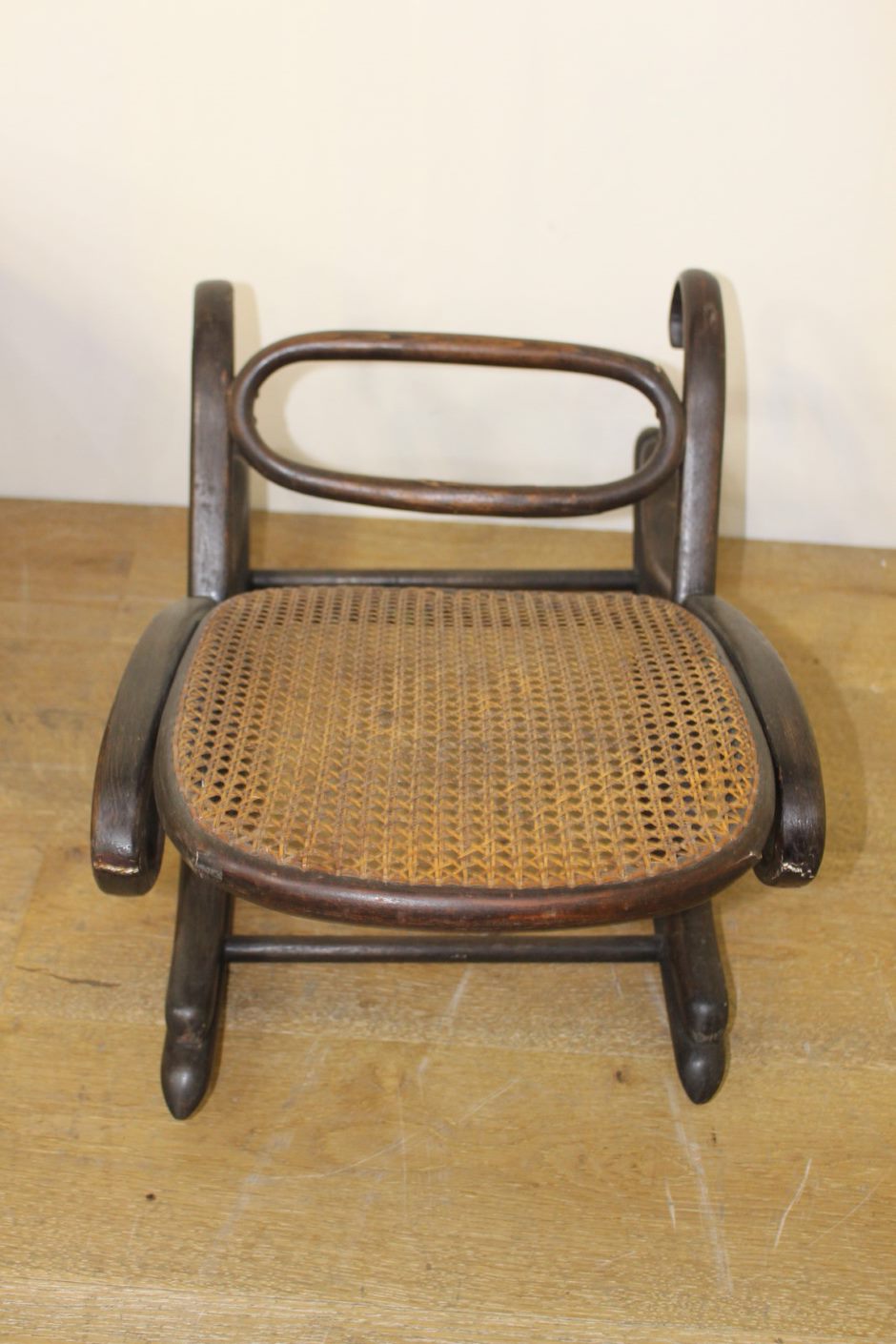 Bentwood rocking rattan footrest