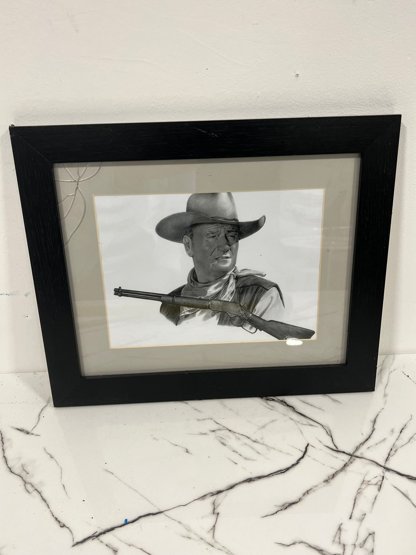 Black and white framed John Wayne picture