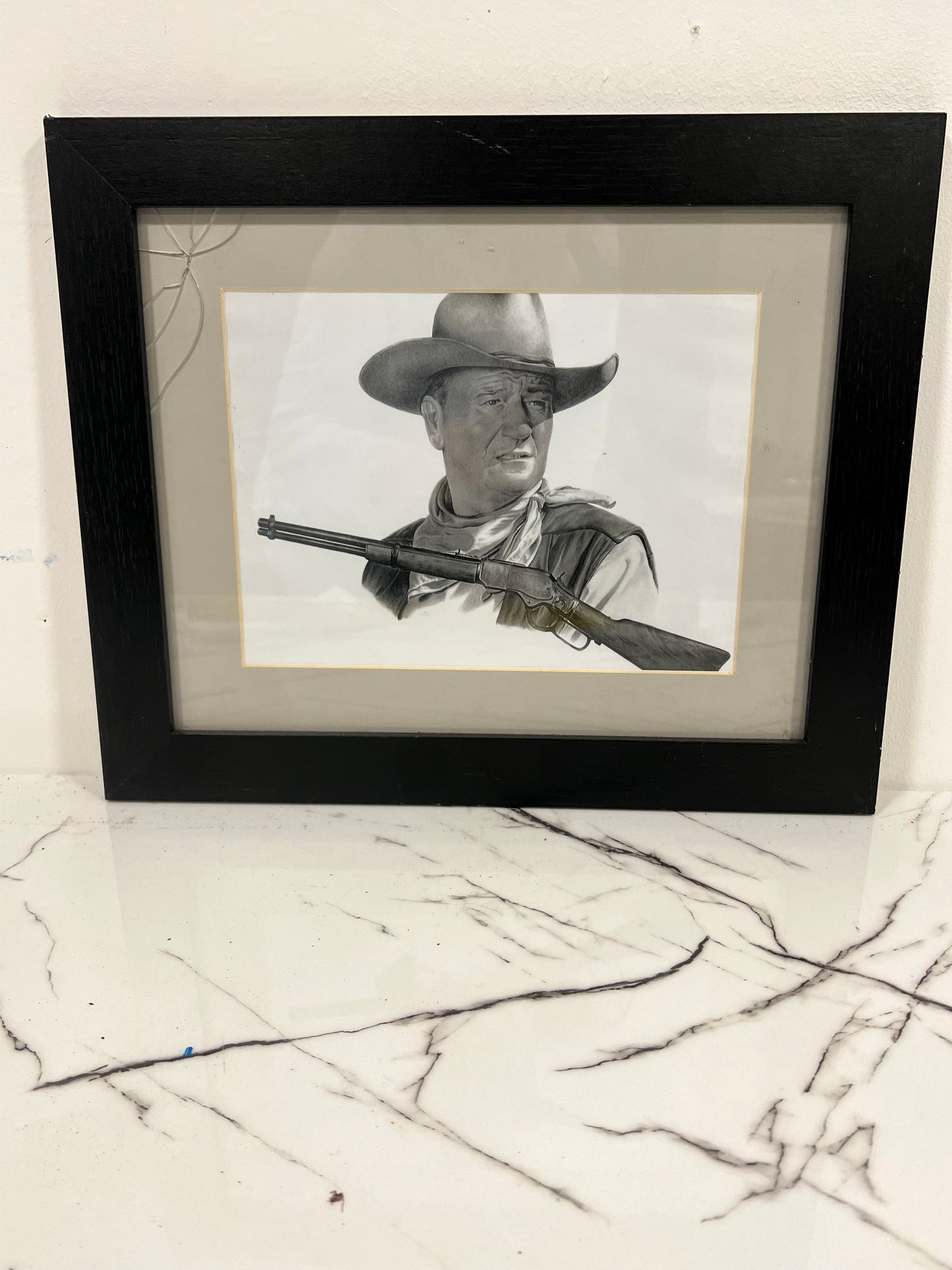 Black and white framed John Wayne picture