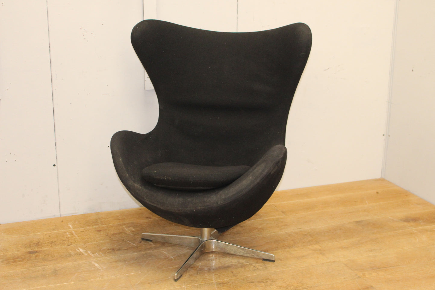 Black velvet upholstered swivel chair