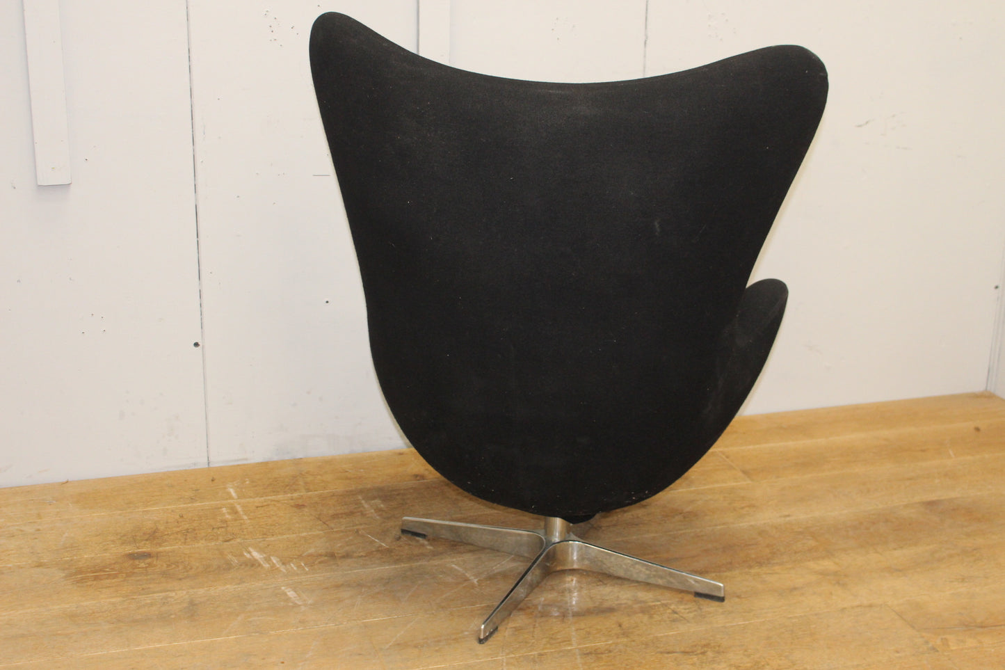 Black velvet upholstered swivel chair