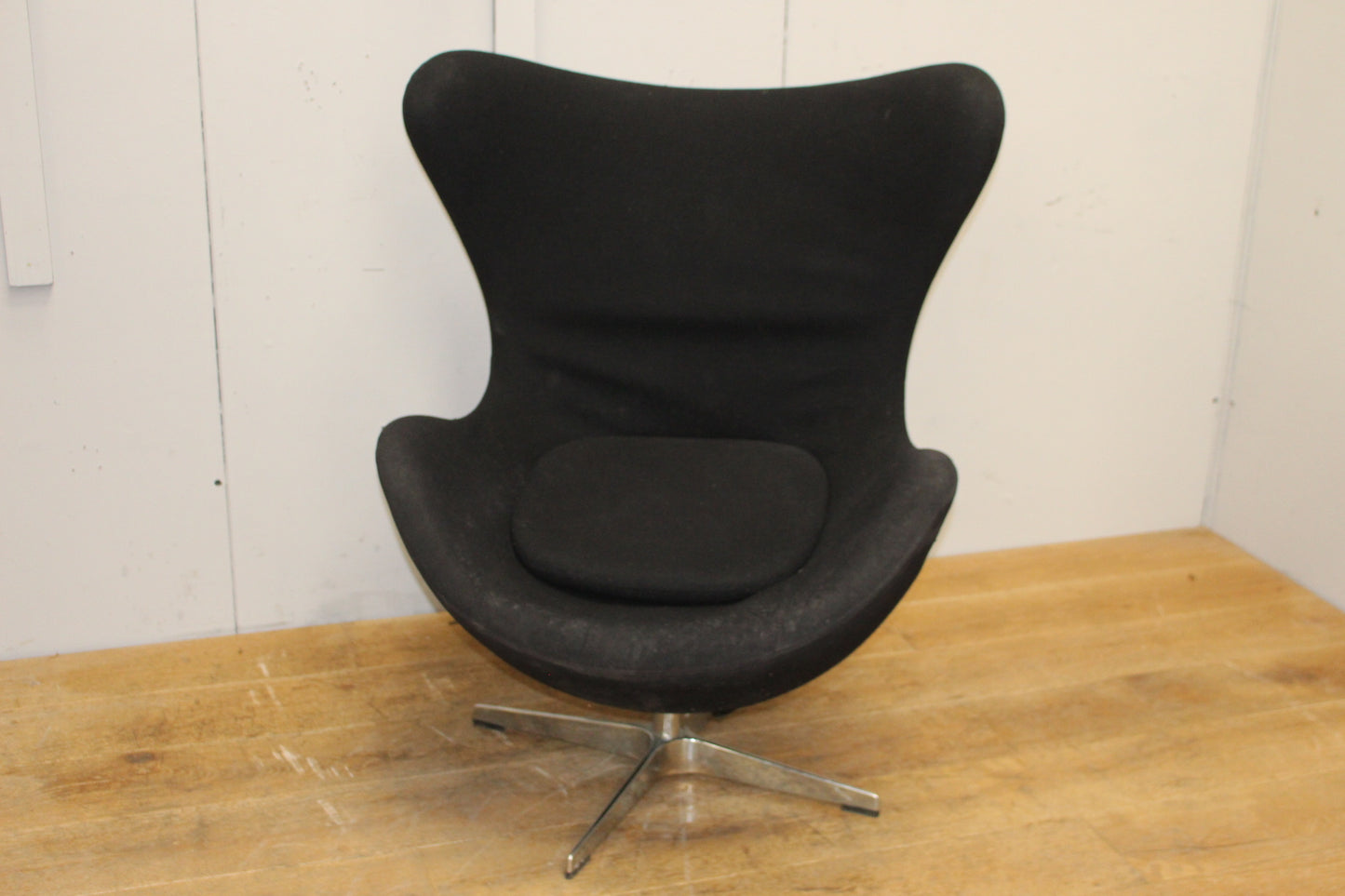 Black velvet upholstered swivel chair