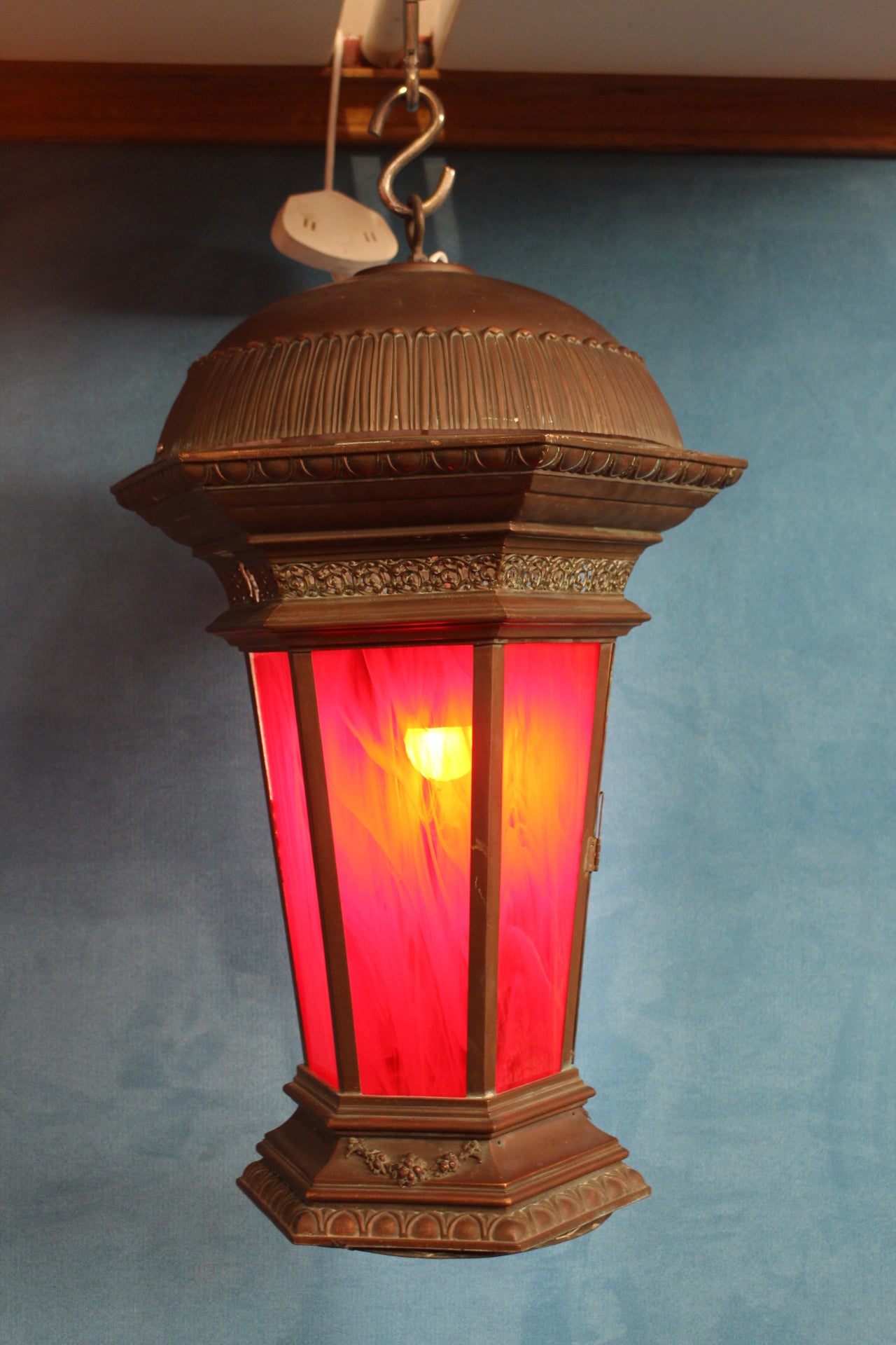 Bronze hanging lantern with red stain glass panels