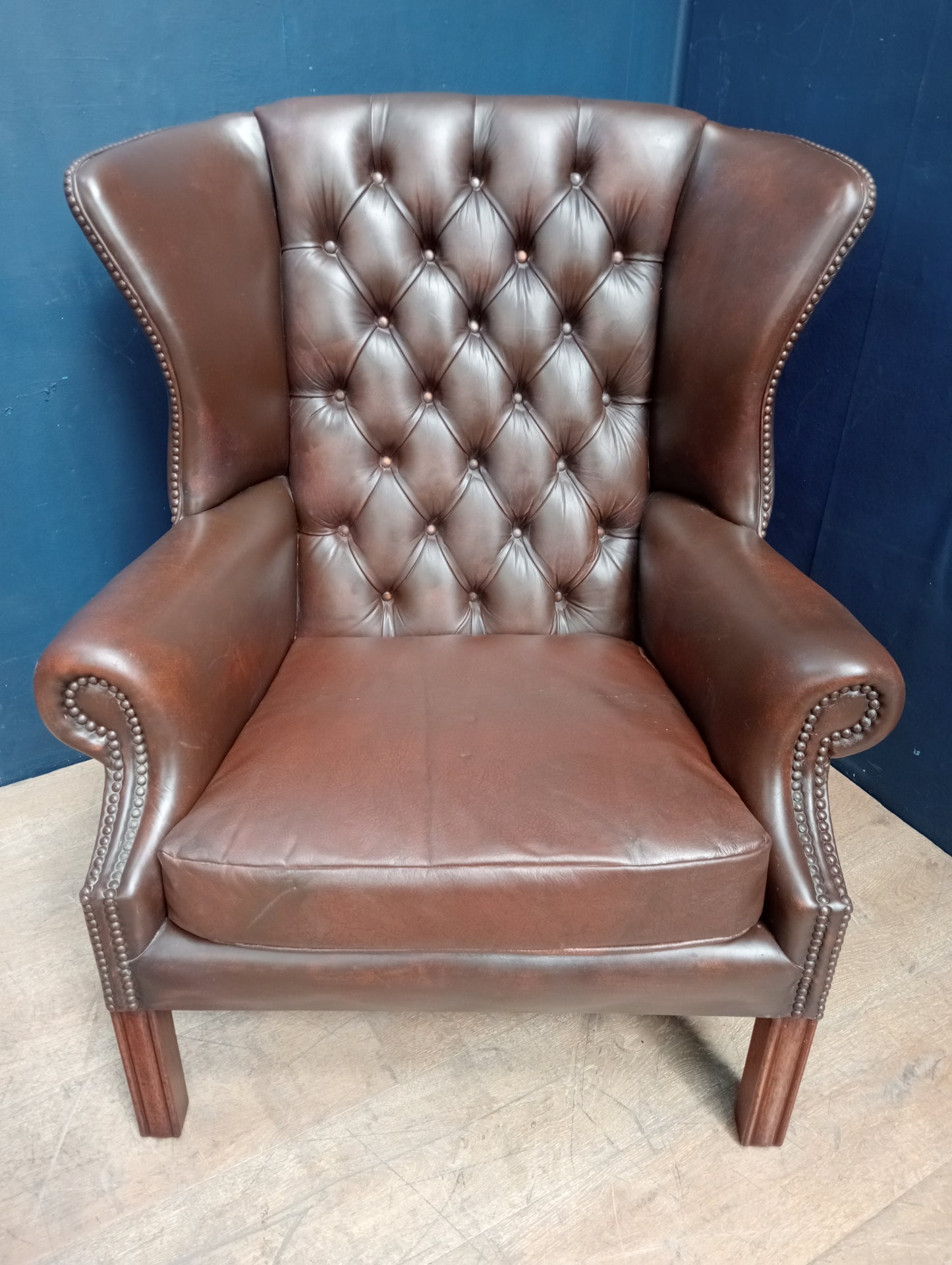 Brown deep button wingback chair