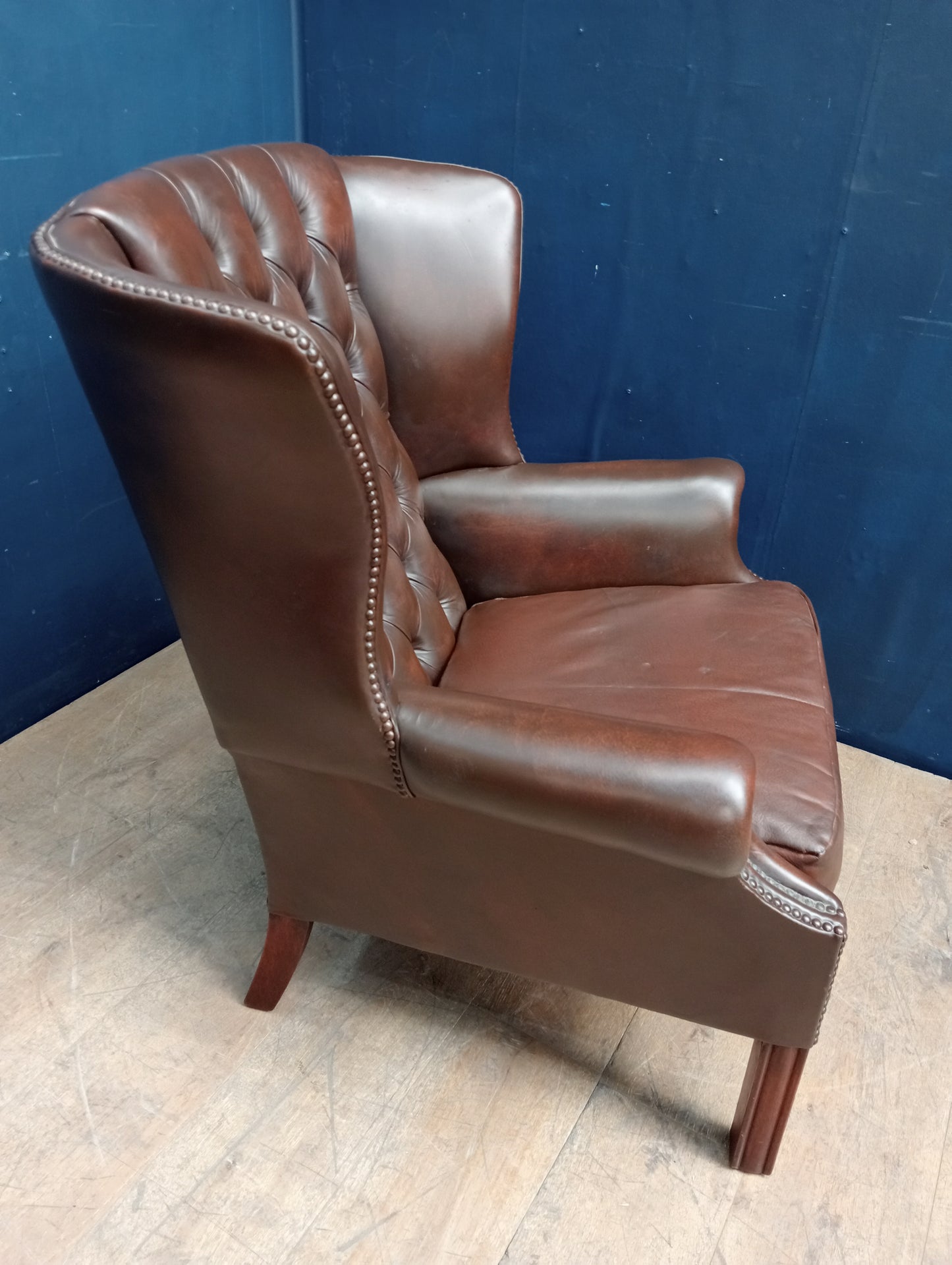 Brown deep button wingback chair