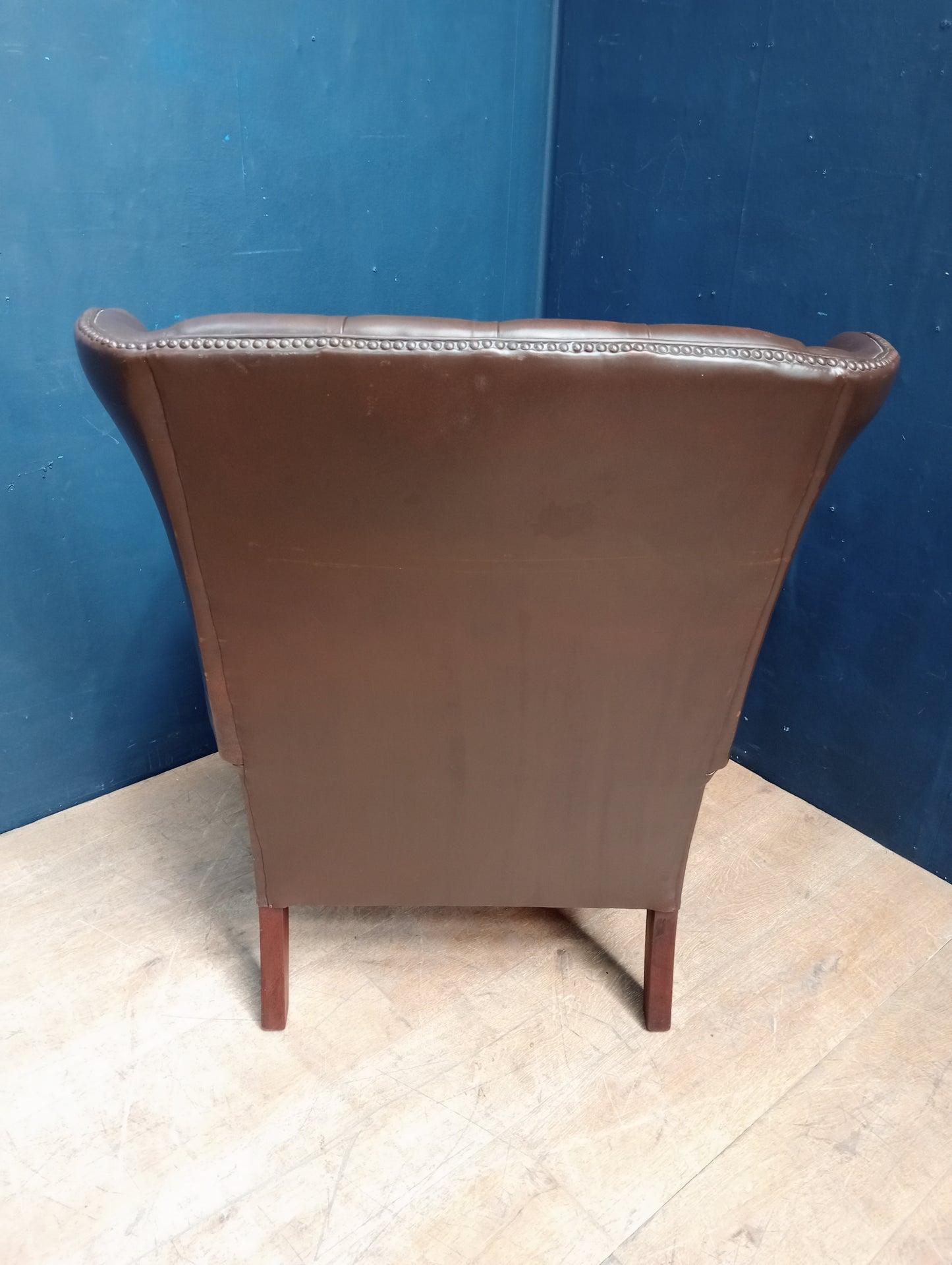 Brown deep button wingback chair