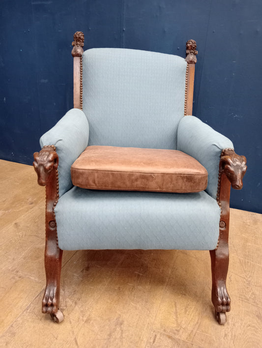 Carved oak side chair on castors lions head and rams head design