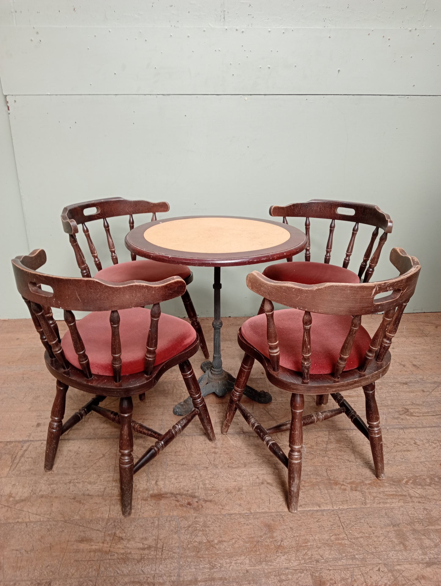 Cast iron table lino top and 4 mates chairs