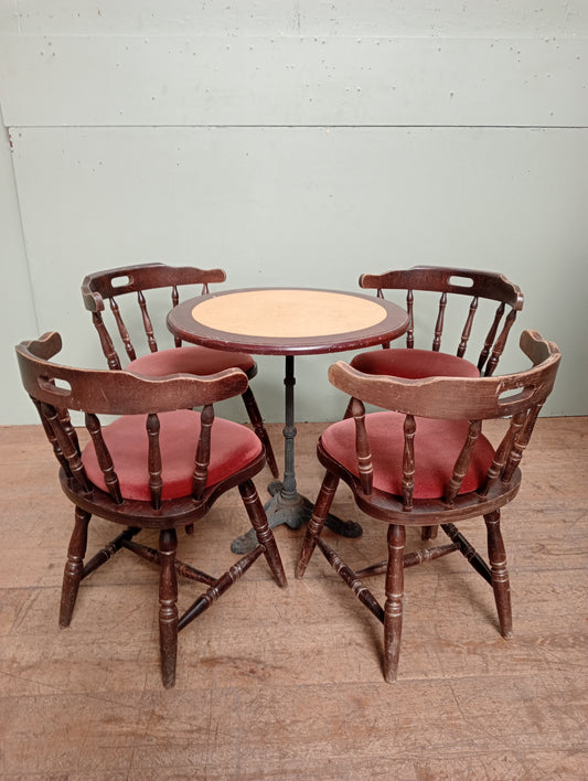 Cast iron table lino top and 4 mates chairs
