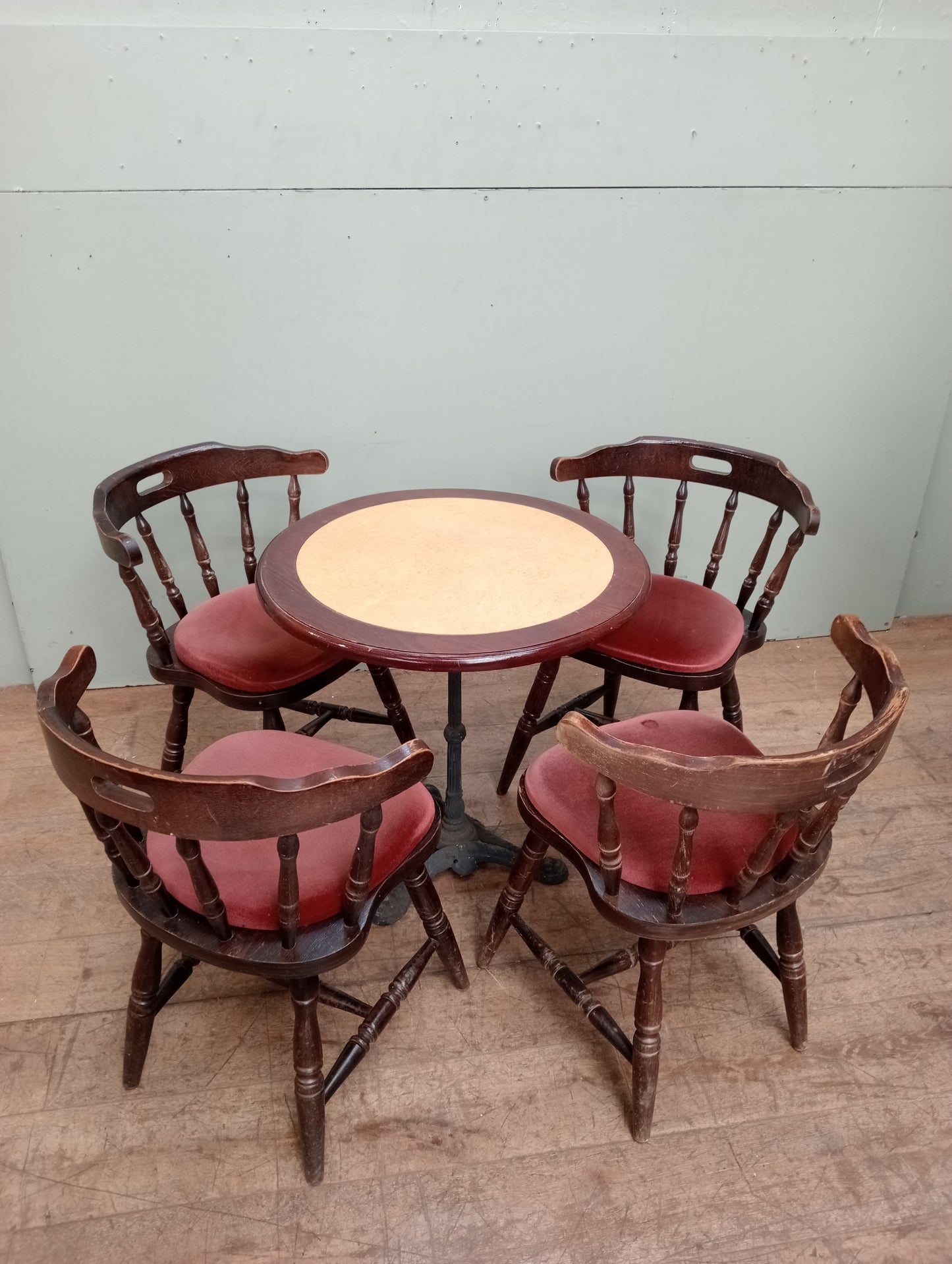 Cast iron table lino top and 4 mates chairs
