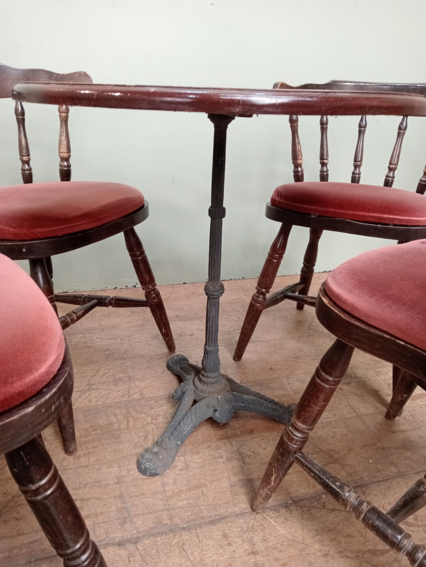 Cast iron table lino top and 4 mates chairs