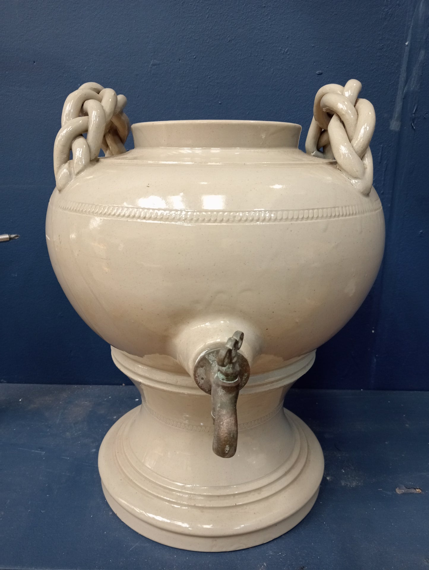 Ceramic urn brass tap