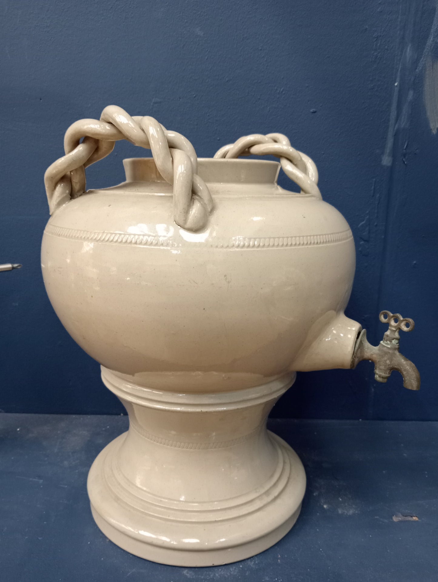 Ceramic urn brass tap