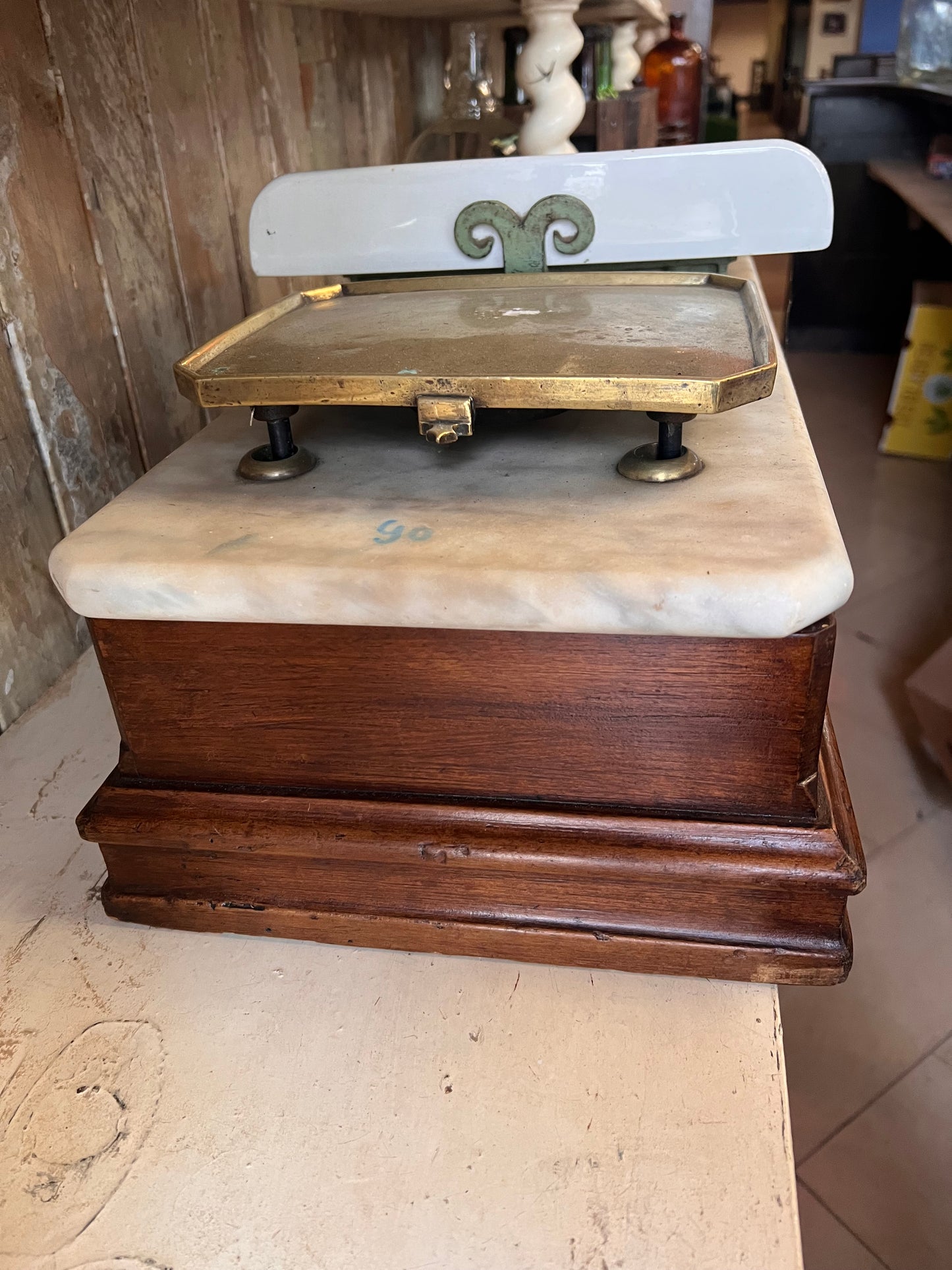 Cermaic and brass scales  with marble top and wooden base