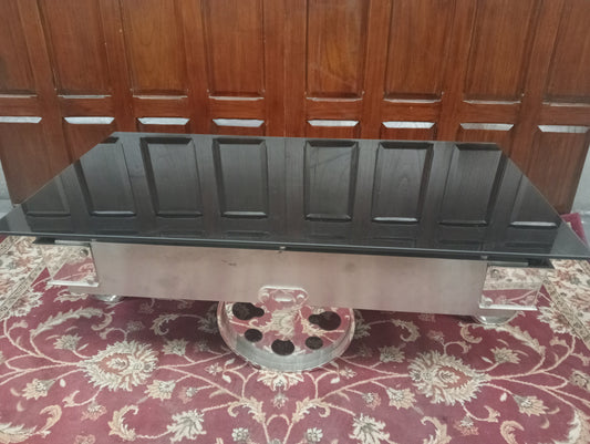 Chrome Coffee table on wheels with black glass top