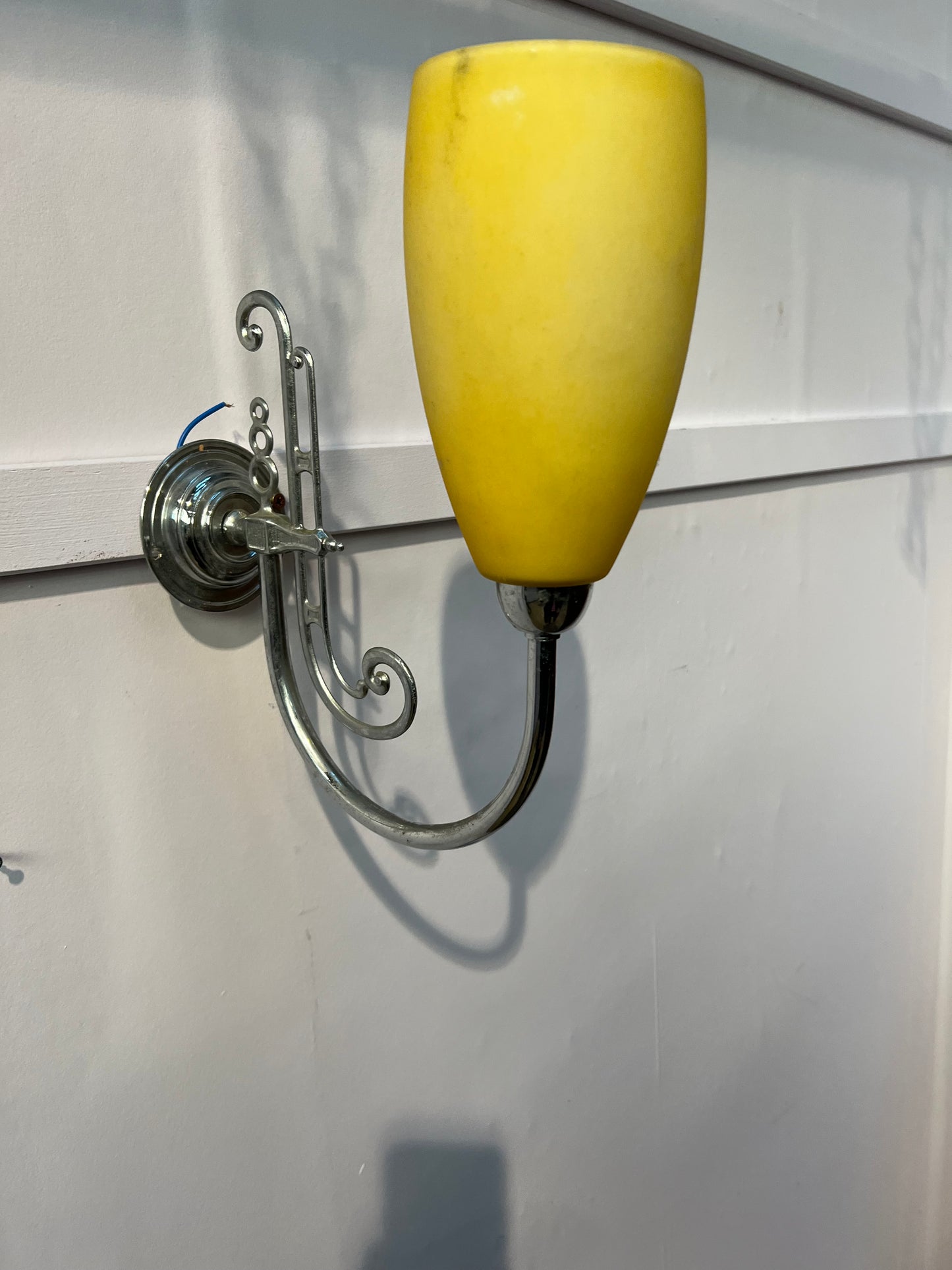 chrome wall light with yellow  shade