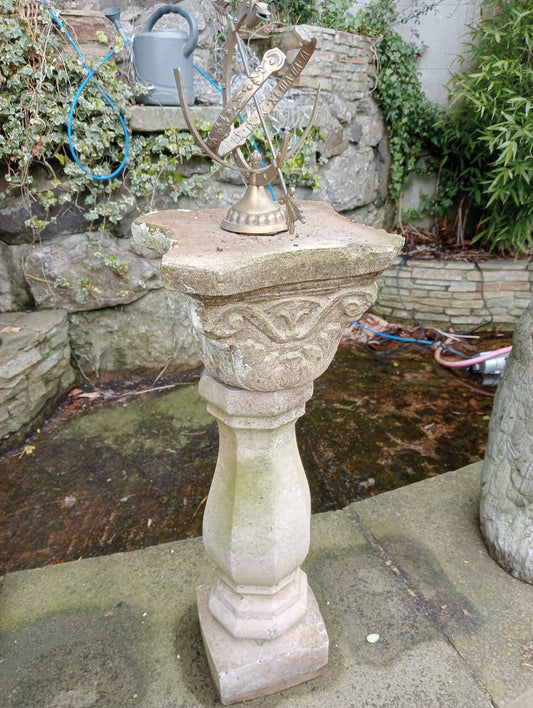 Composition stone pedestal with brass armillary