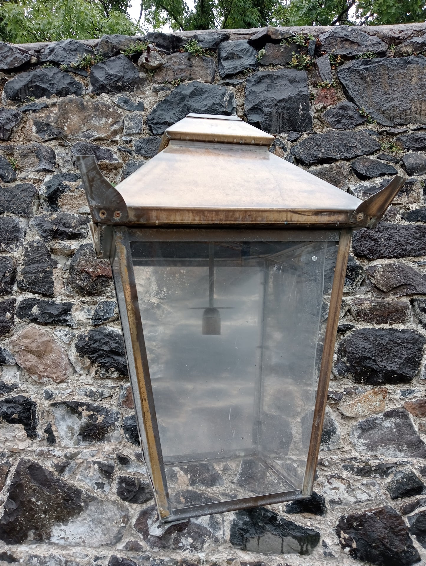 Copper wall light with wrought iron bracket