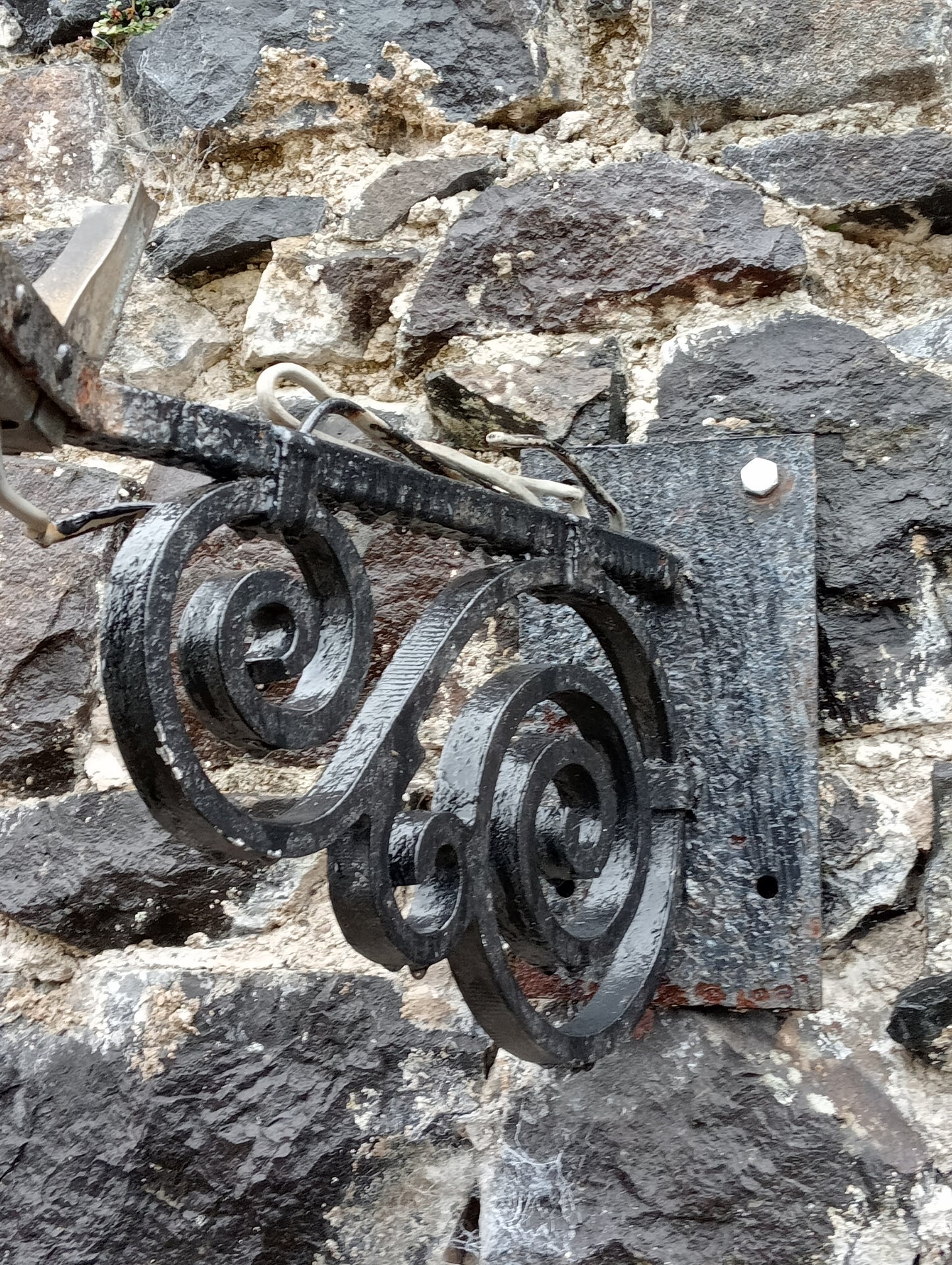 Copper wall light with wrought iron bracket