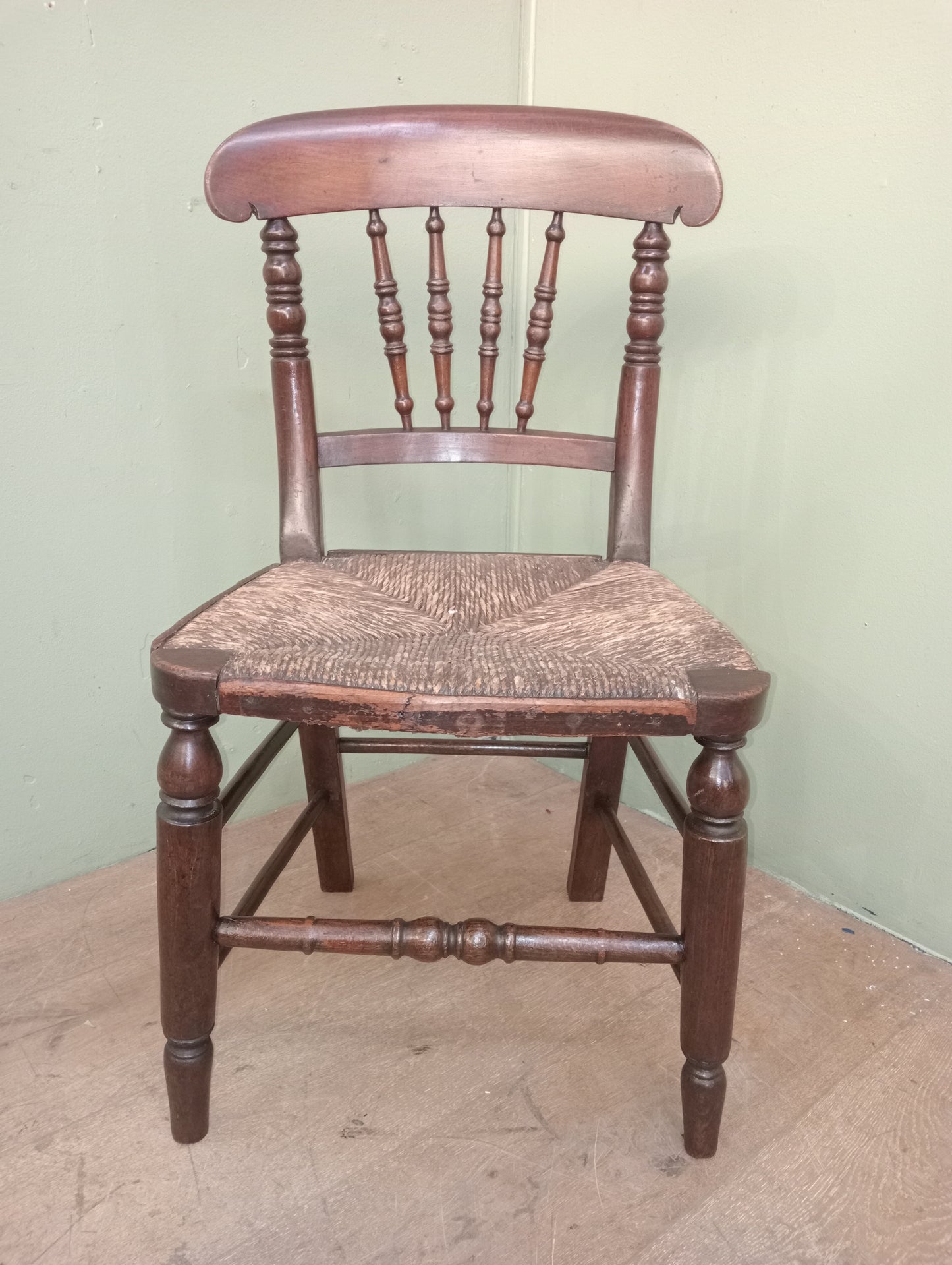 Early 19th C Elm spindle back chair with original rush seat
