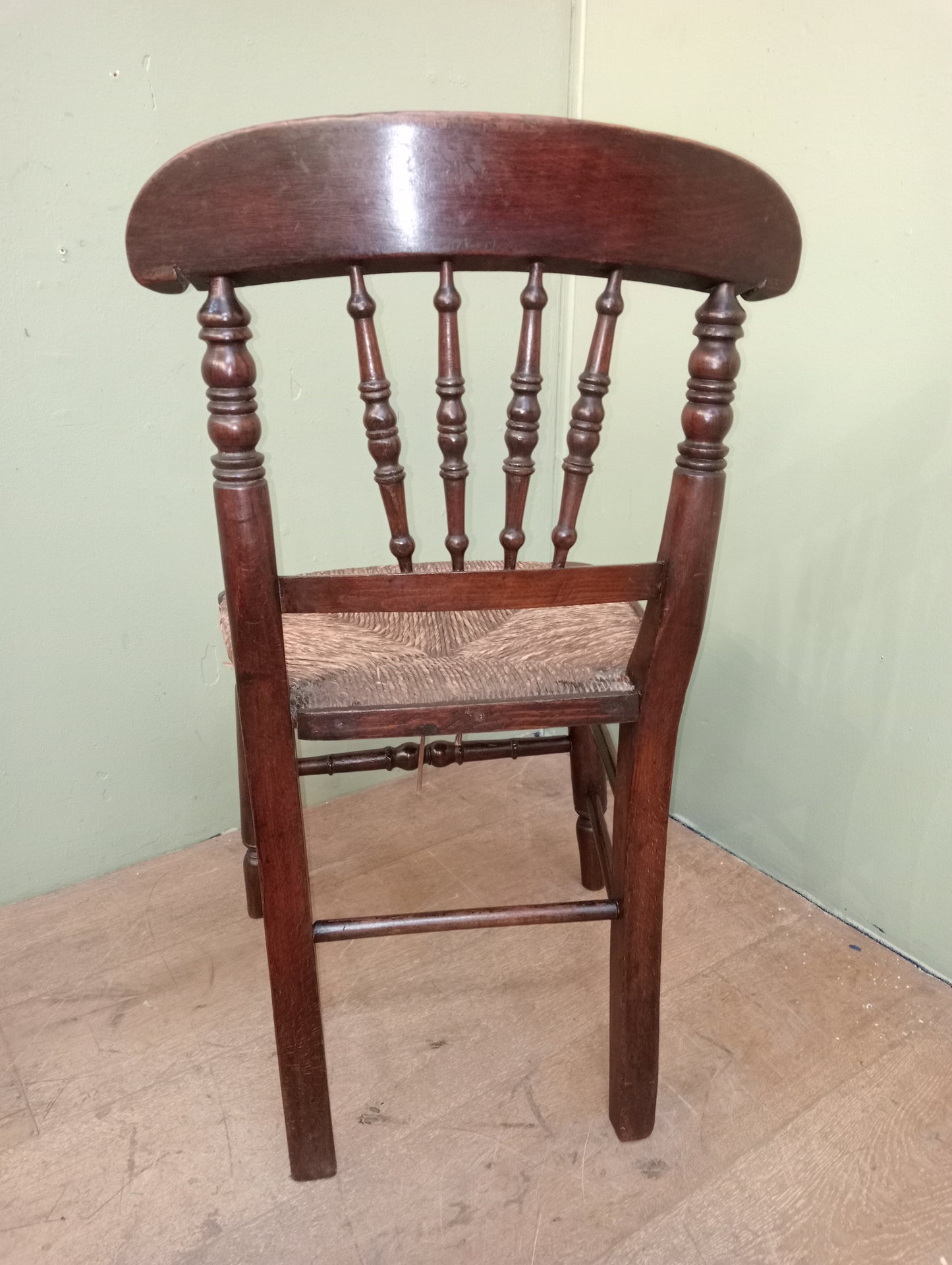 Early 19th C Elm spindle back chair with original rush seat