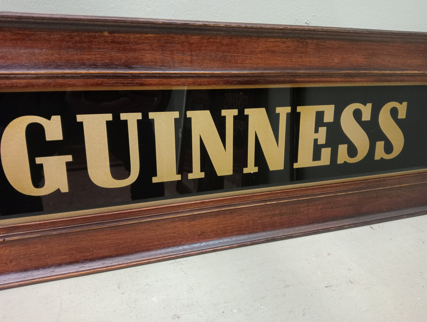 Framed Guinness sign black glass