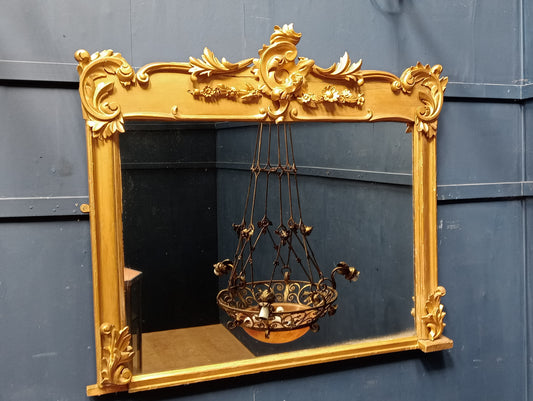 Gilt overmantle mirror with foliate surmount