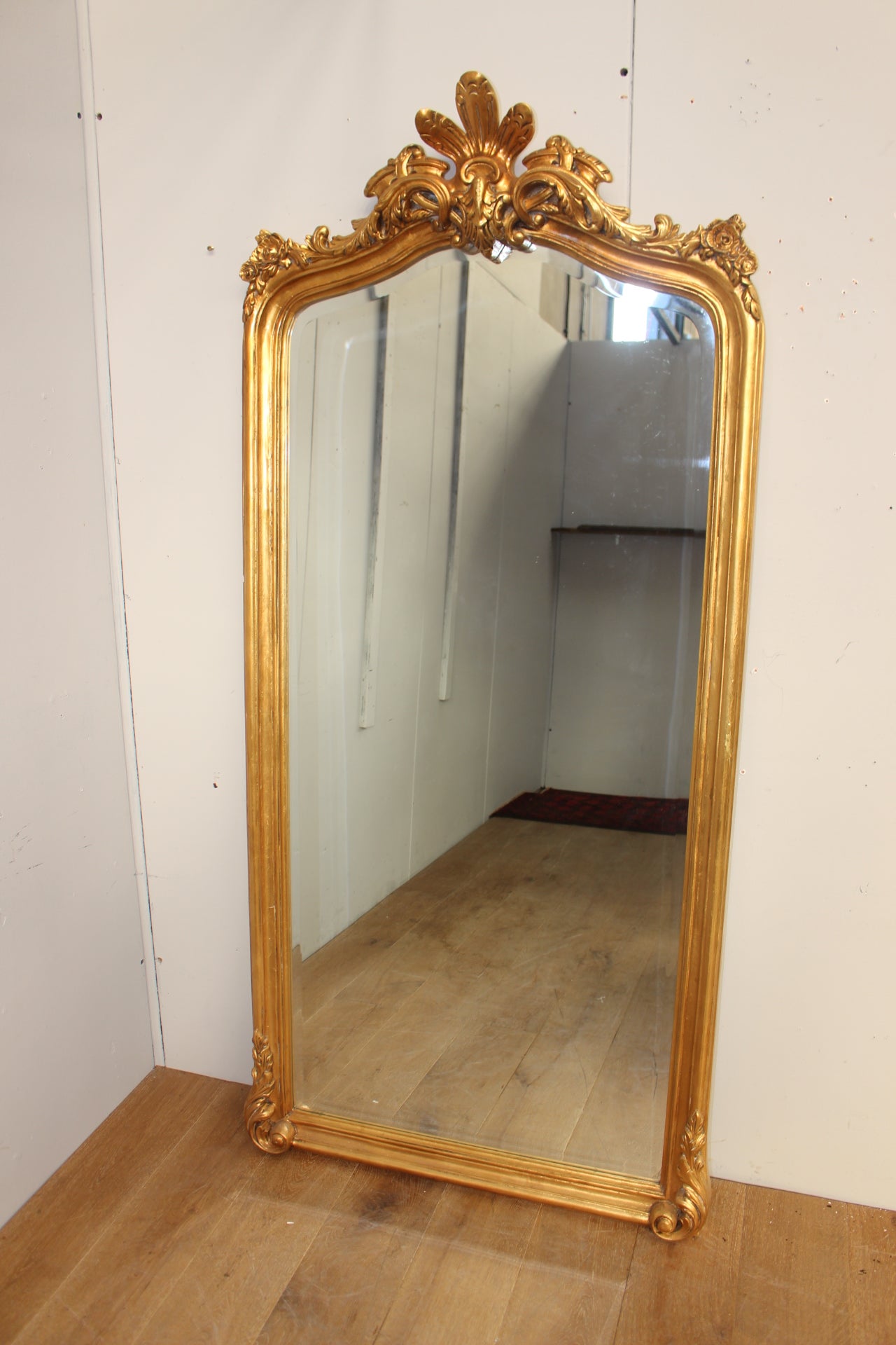 Giltwood mirror decorated with roses