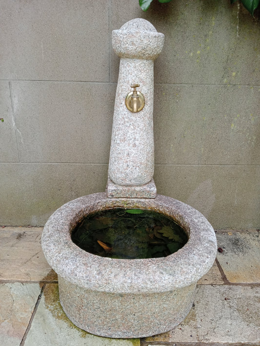 Granite water feature with brass tap