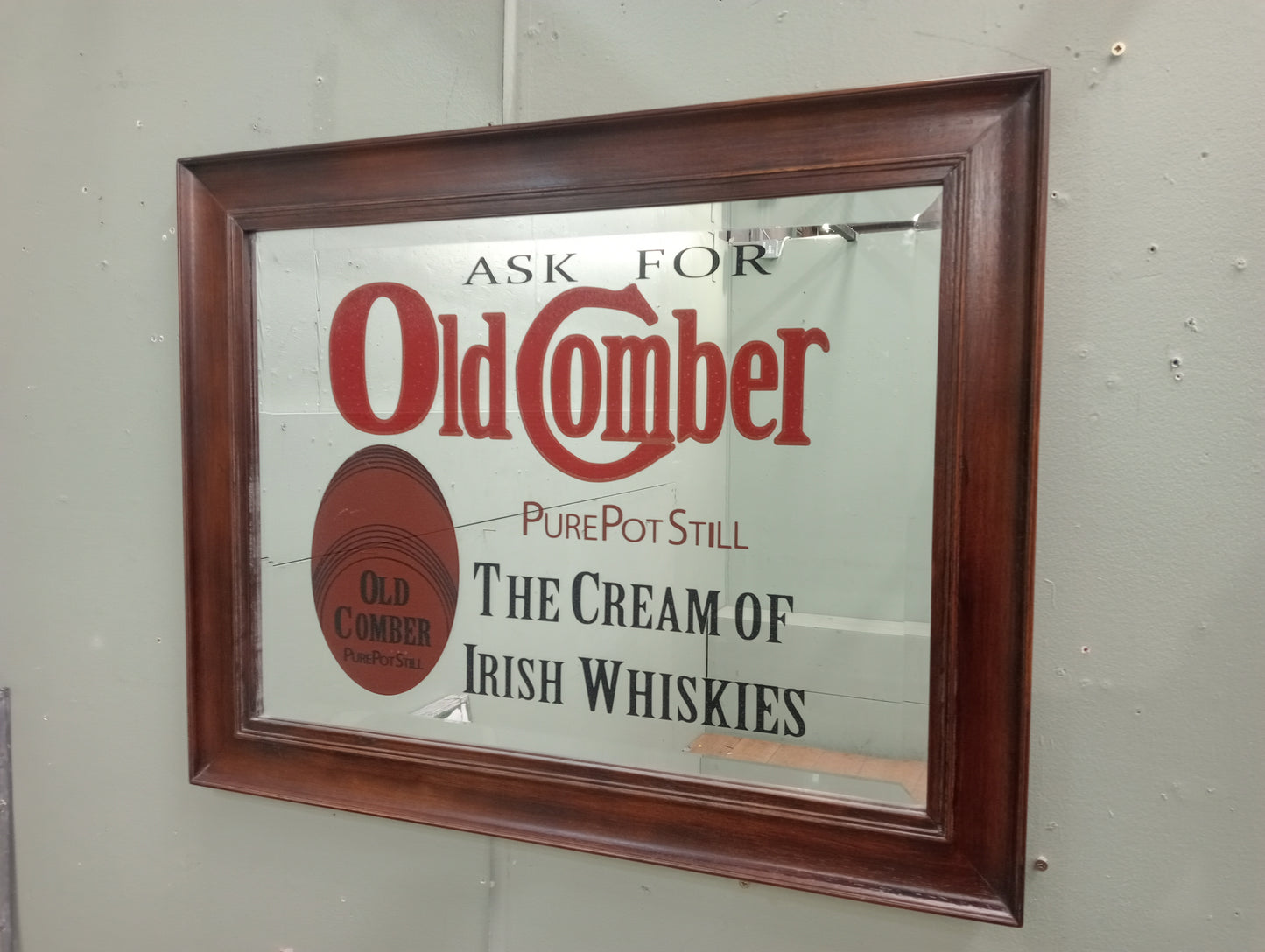 Ask for old Comber pure pot still the cream of Irish whiskies bevelled advertising mirror
