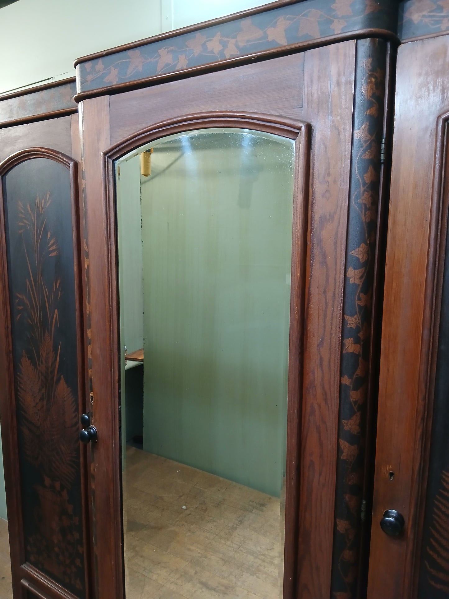 Irish George III style triple fern ware wardrobe with 2 doors to each side internal brass clothes rail central pane; with dome topped mirror, drawer to base