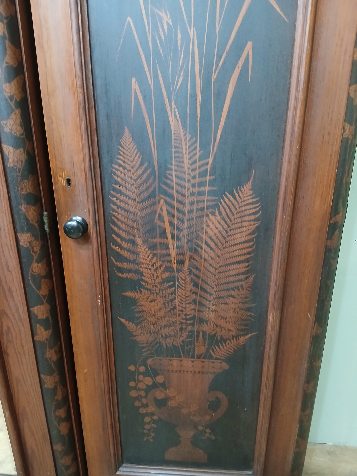 Irish George III style triple fern ware wardrobe with 2 doors to each side internal brass clothes rail central pane; with dome topped mirror, drawer to base