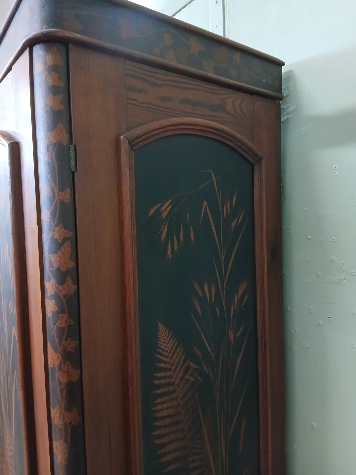 Irish George III style triple fern ware wardrobe with 2 doors to each side internal brass clothes rail central pane; with dome topped mirror, drawer to base