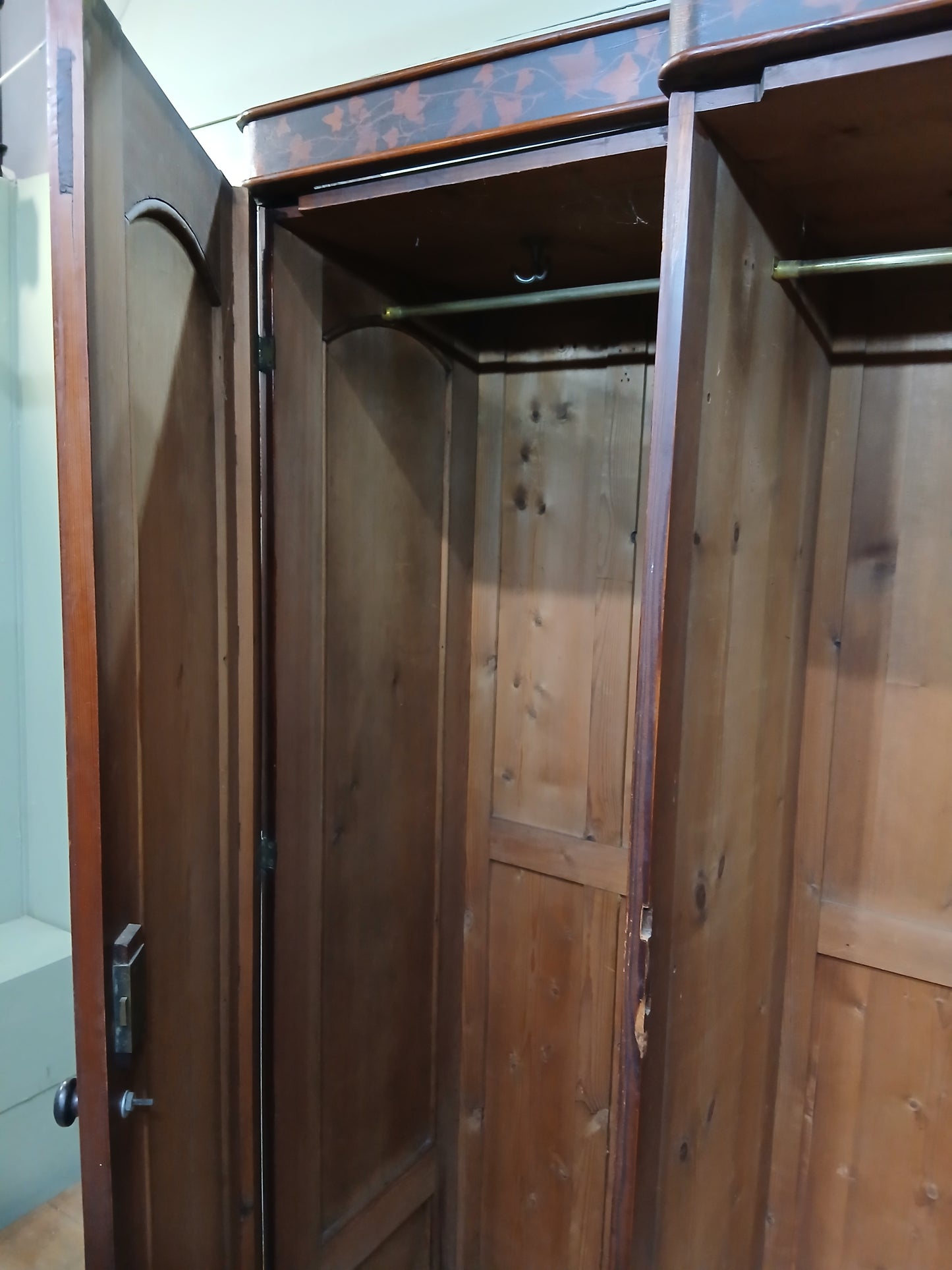 Irish George III style triple fern ware wardrobe with 2 doors to each side internal brass clothes rail central pane; with dome topped mirror, drawer to base
