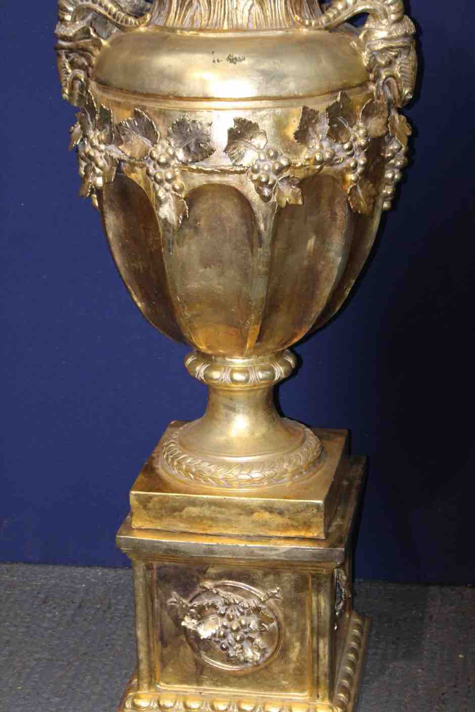 Large ramshead gold guilt urn on stand