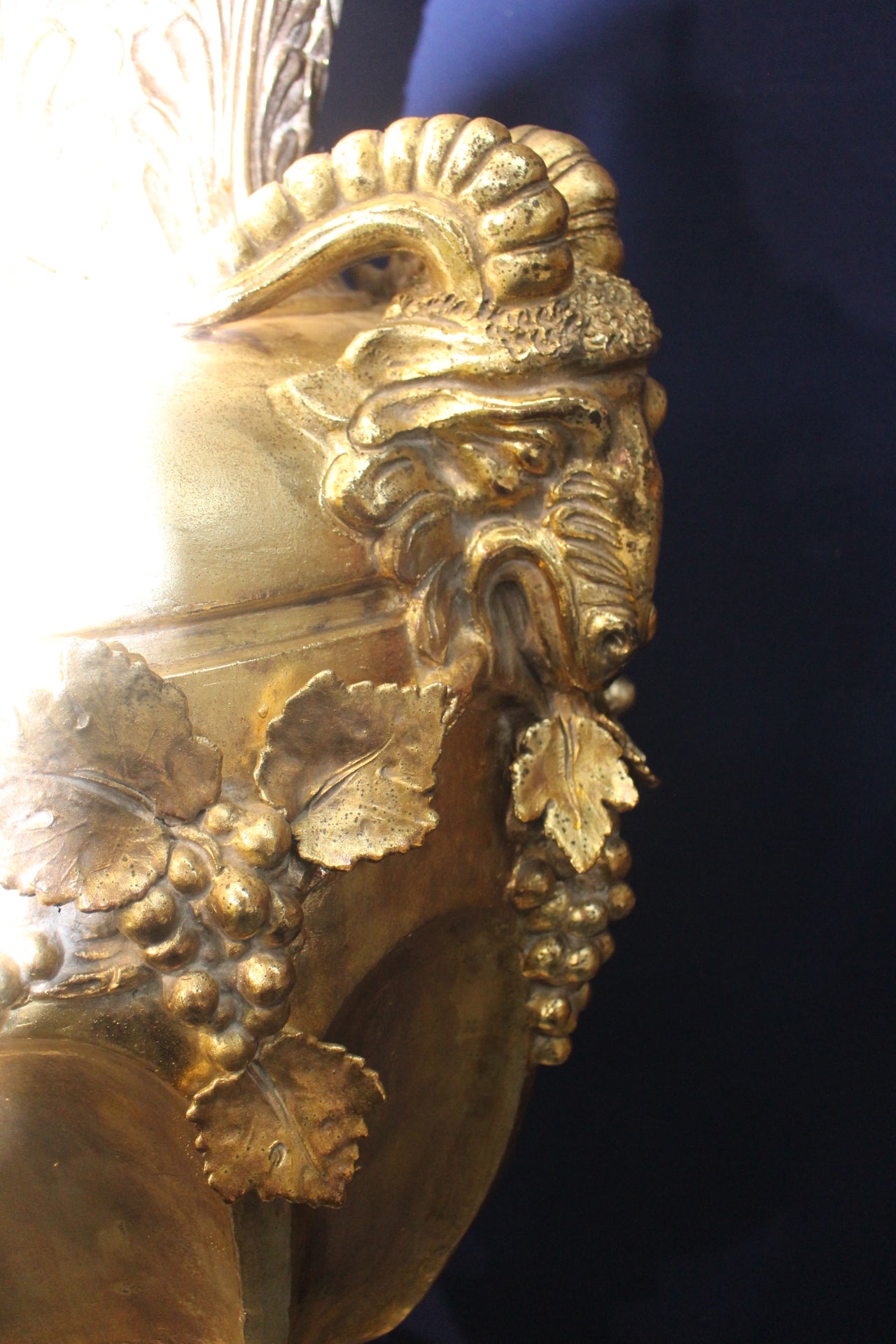 Large ramshead gold guilt urn on stand