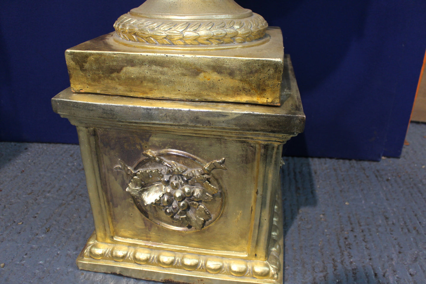 Large ramshead gold guilt urn on stand