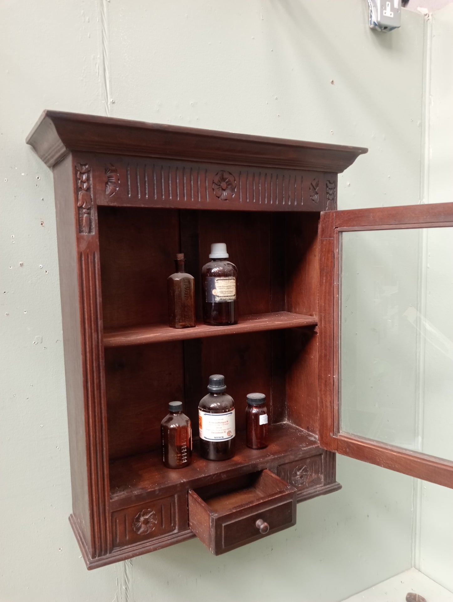 Mahogany wall mounted apothecary cabinet