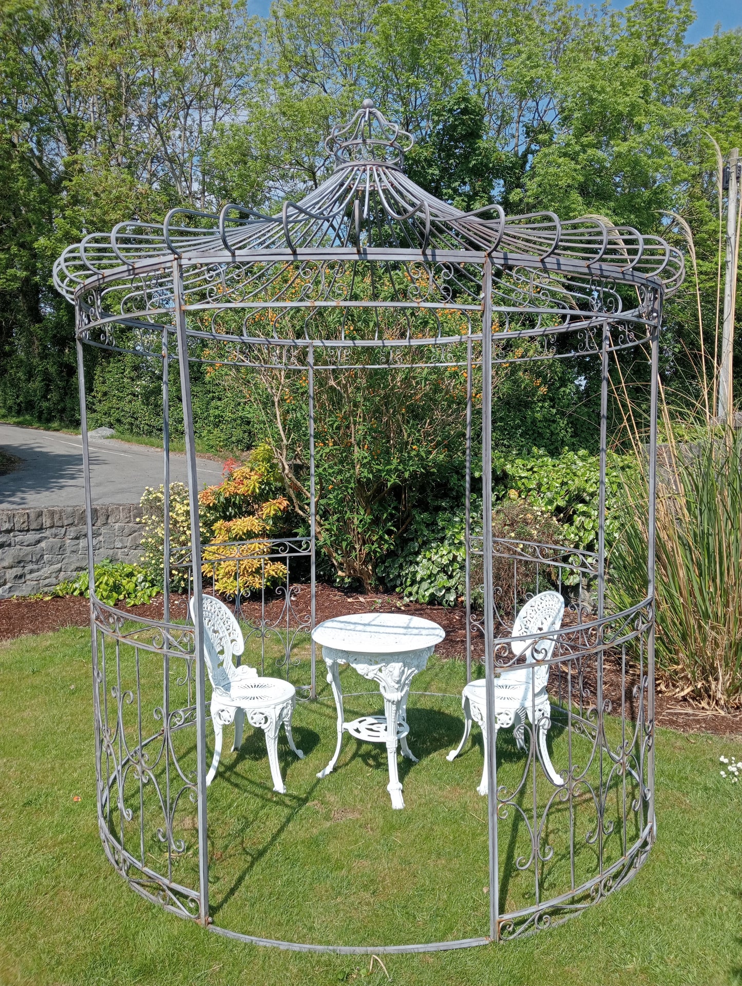 Metal garden gazebo with scroll design