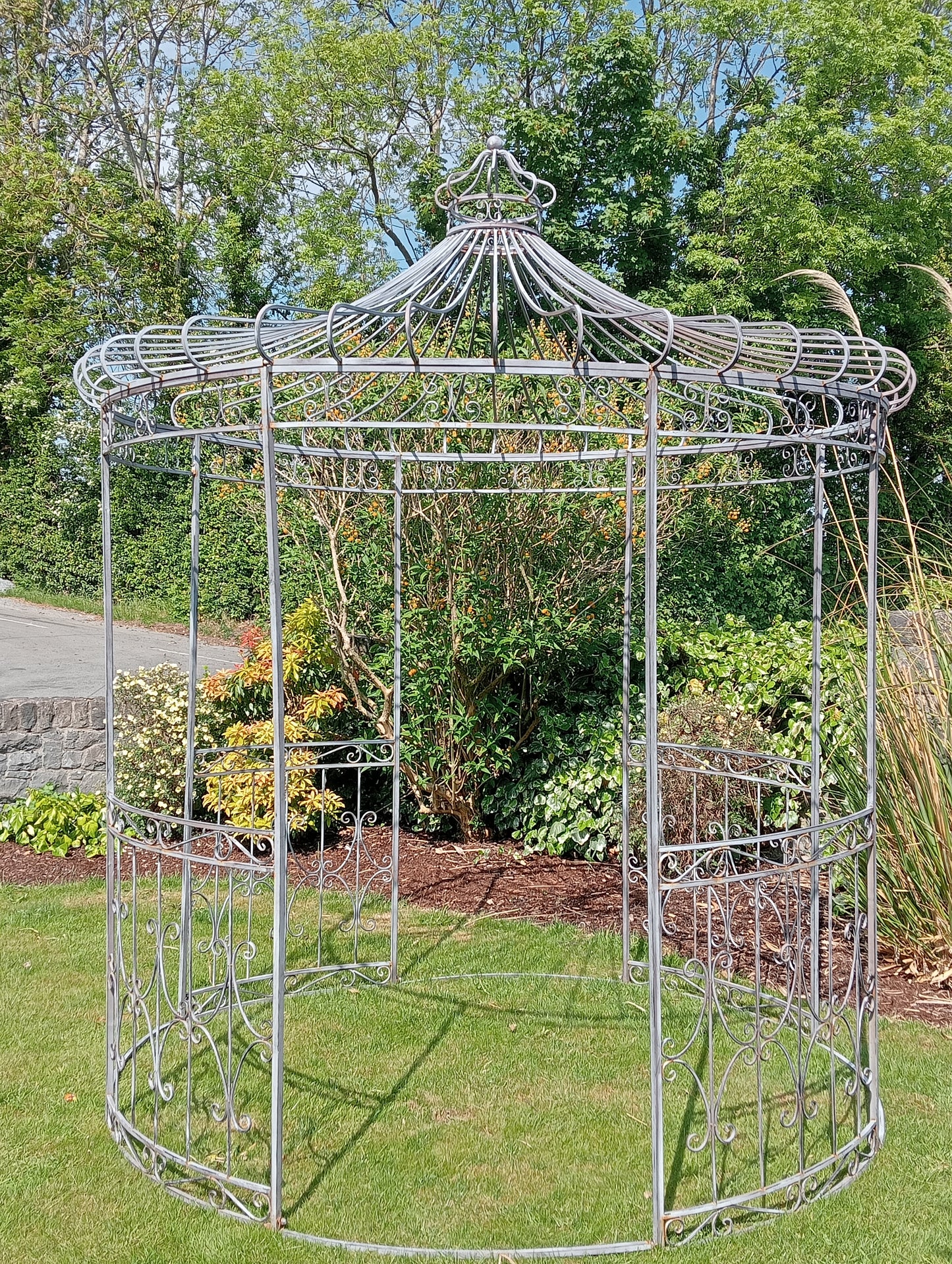 Metal garden gazebo with scroll design