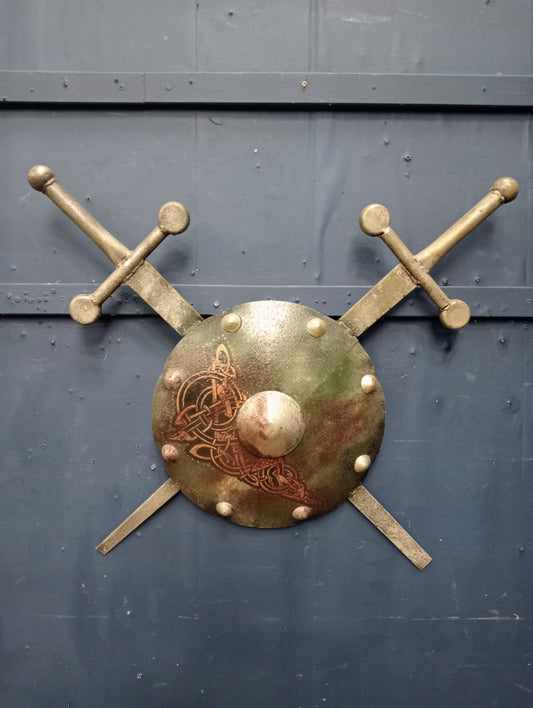 Metal shield with swords