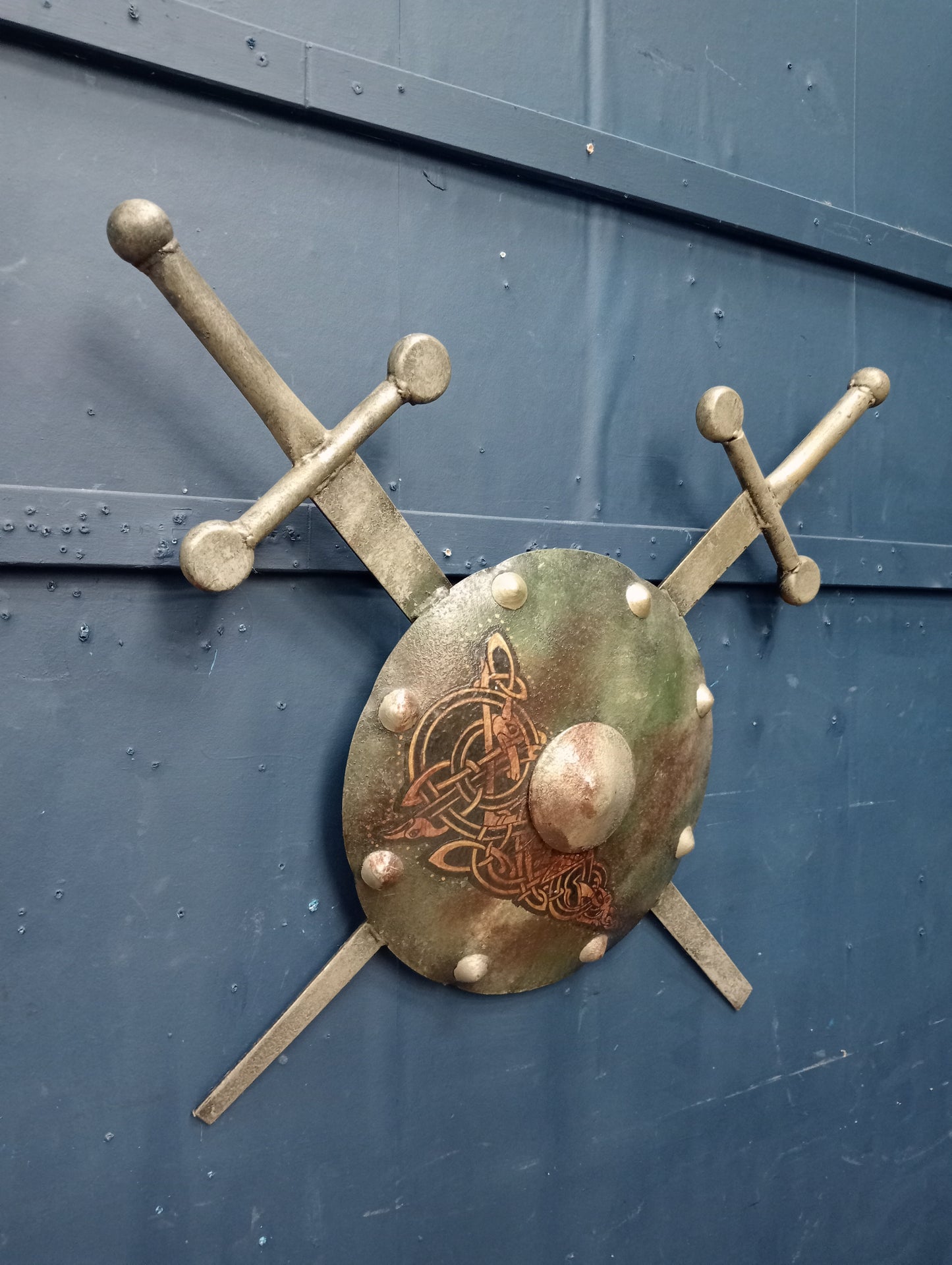 Metal sheild with swords