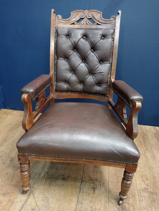 Oak deep button leather armchair on casters