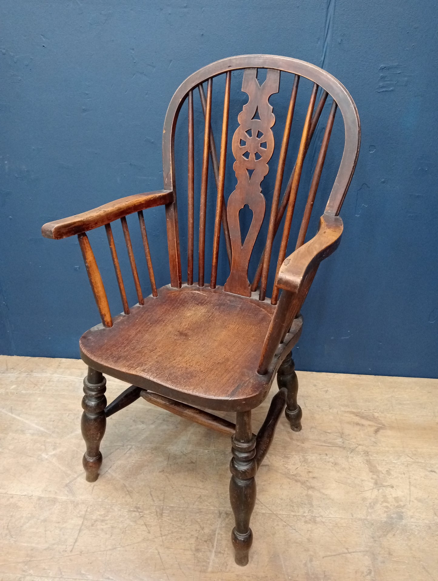 Oak wheel back spindle chair