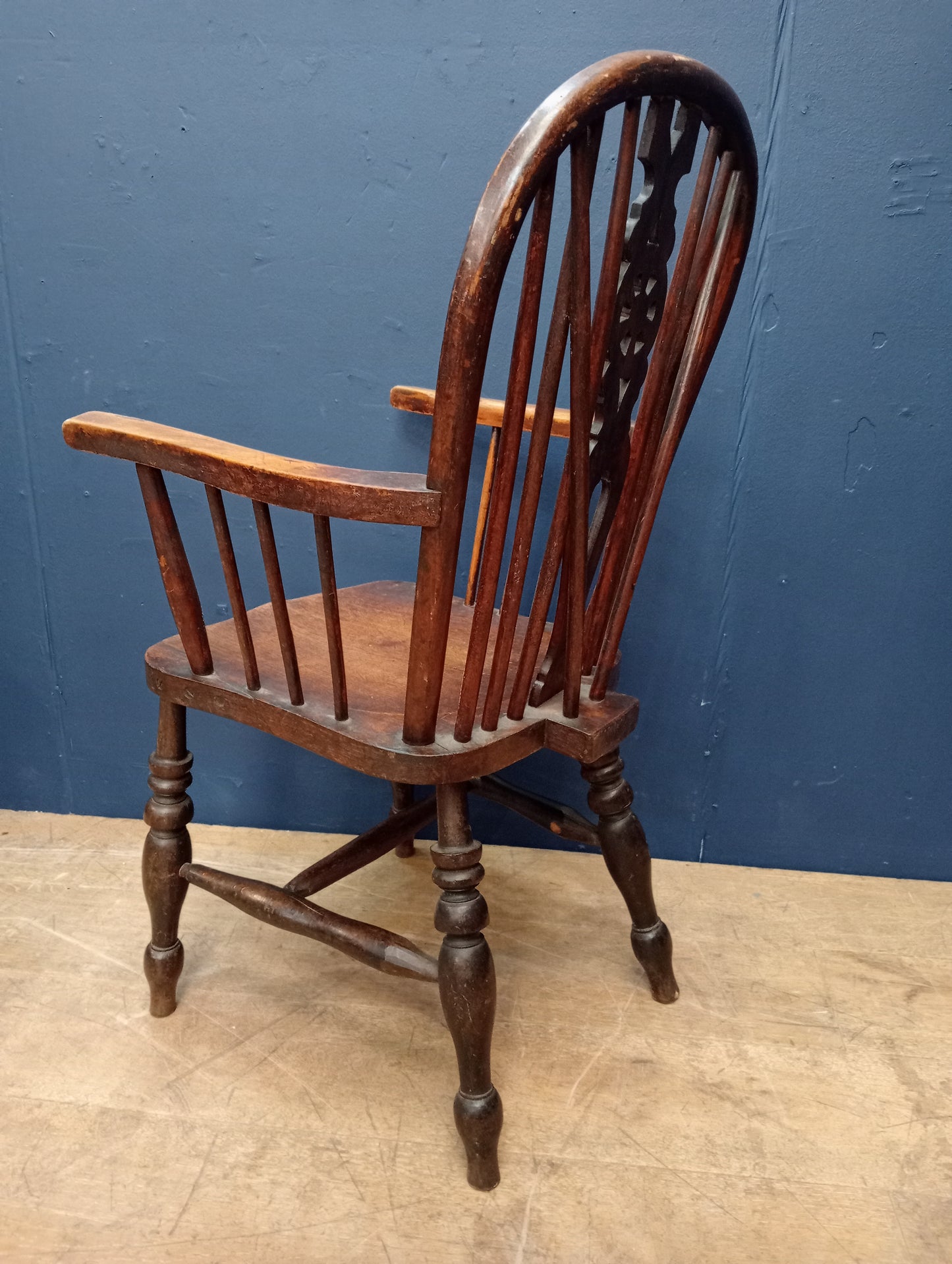 Oak wheel back spindle chair