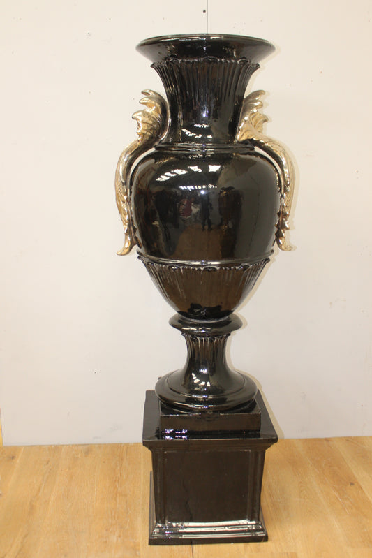 Ornate gold and black Italian hand painted urn on base decorated with Acanthus leaves