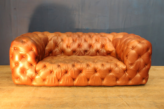 Overstuffed deep button leather chesterfield sofa