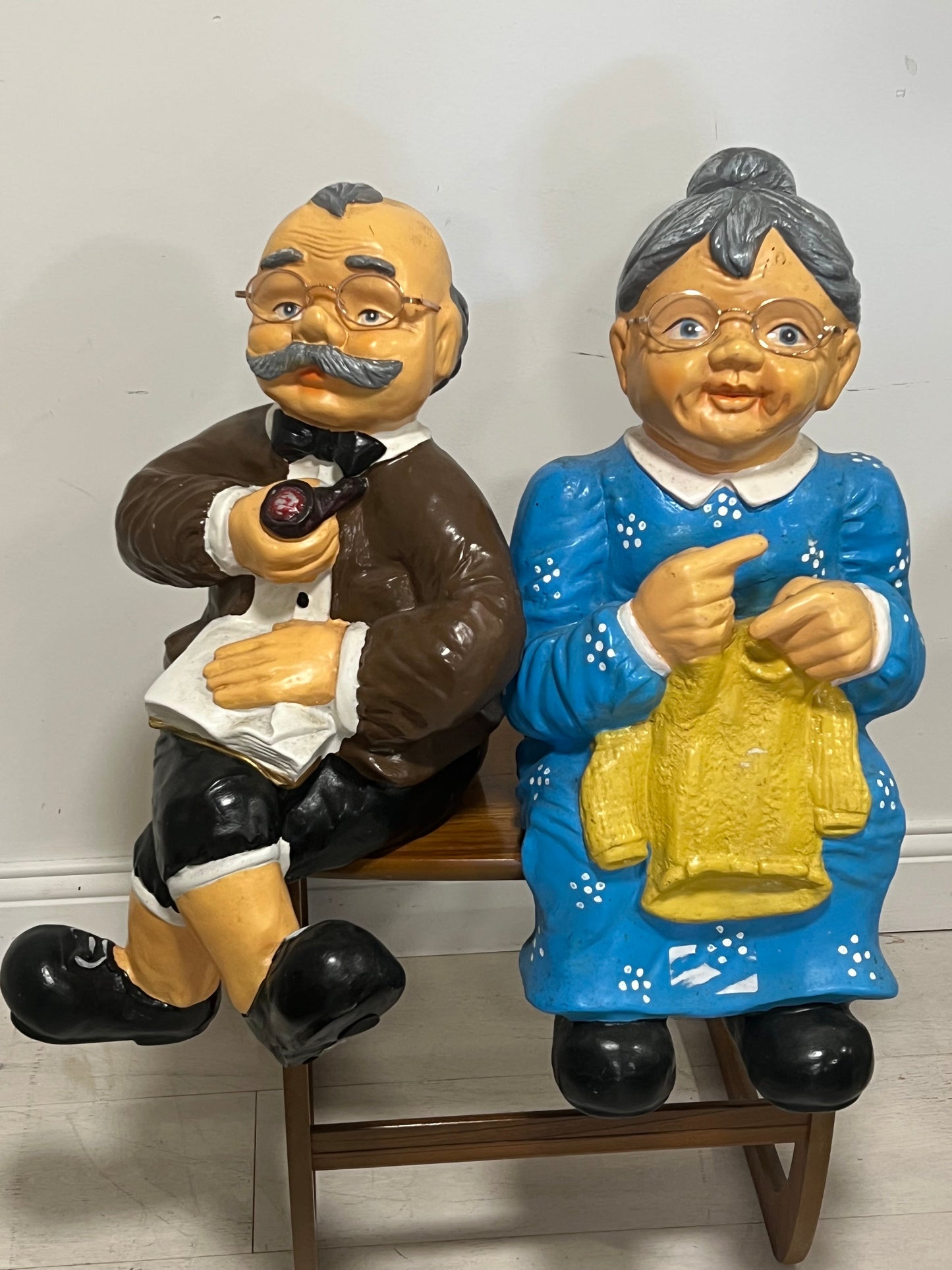 Pair of old couple resin figures